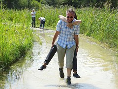 man carrying woman